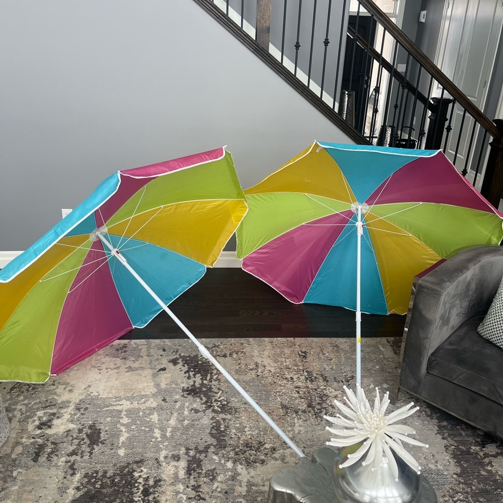 A matching pair of sun beach 🏝️ umbrellas packable perfect for the beach cute